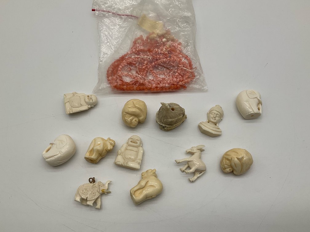 Coral Beads and Carved Figural Accent Beads