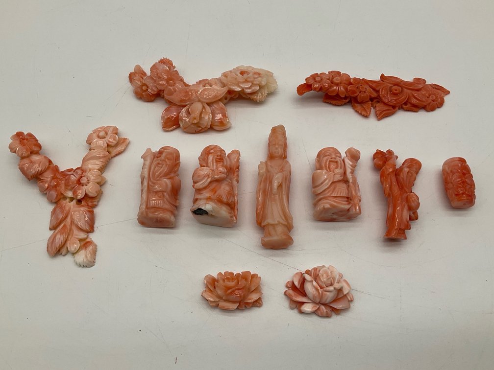 Carved Coral Figures and Floral Bouquets