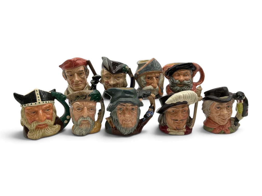 Nine Royal Doulton Toby Jugs