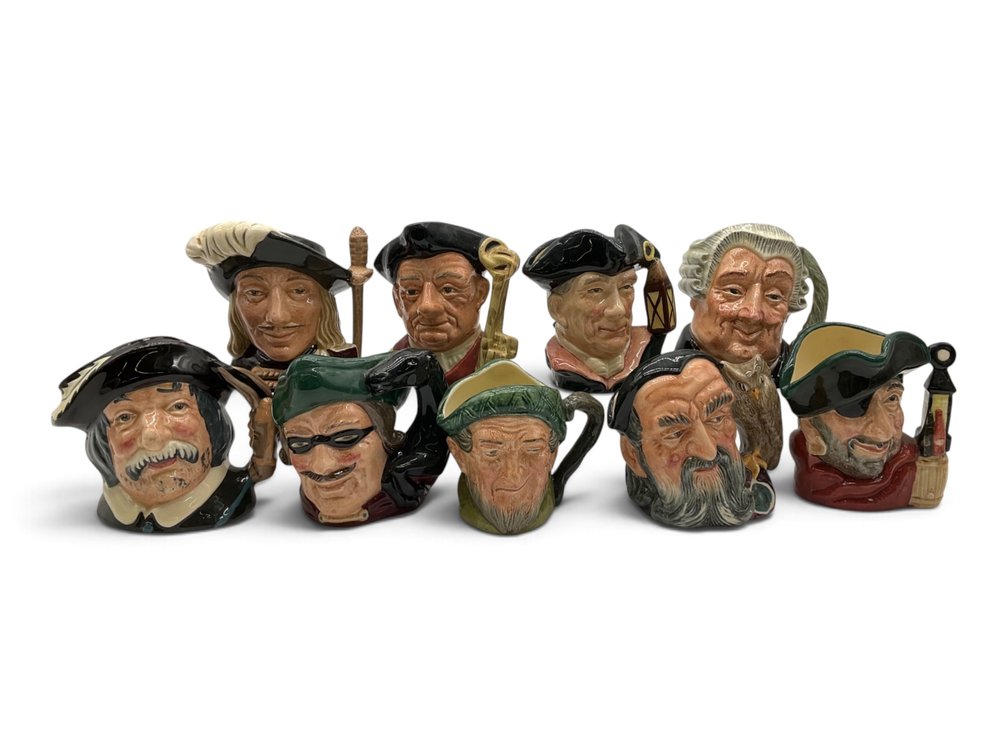 Nine Royal Doulton Toby Jugs