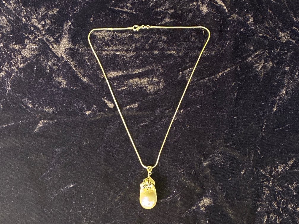 Sterling with large freshwater pearl