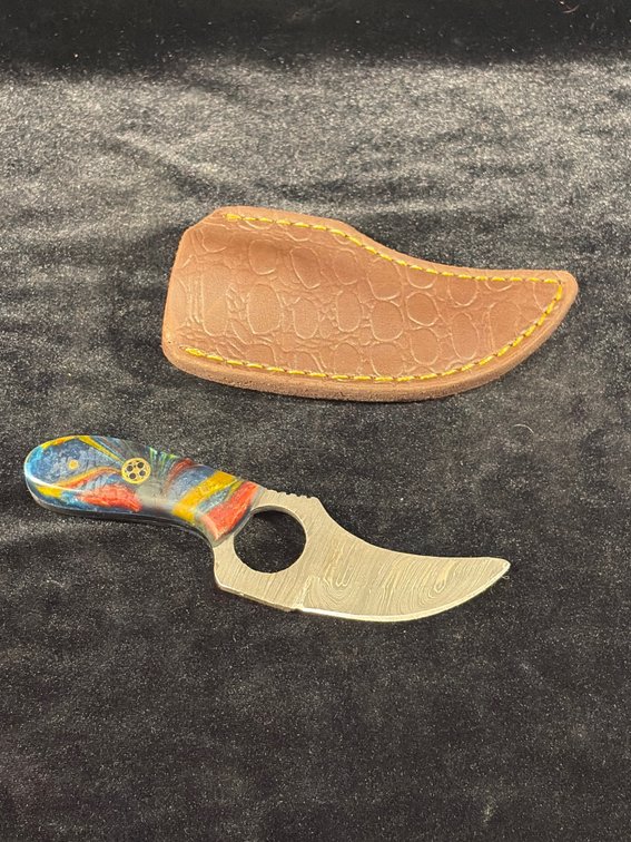 Small handcrafted, Damascus blade knife with finger loop and leather sheath