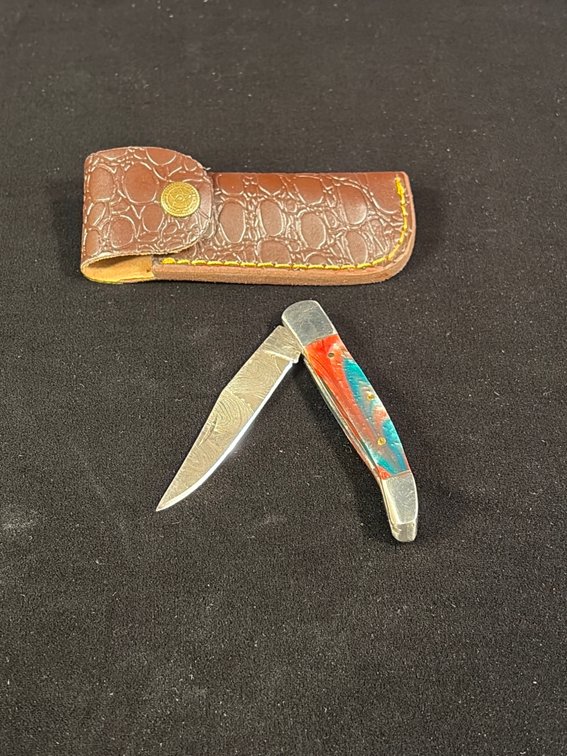 Handcrafted Damascus folding knife with leather sheath