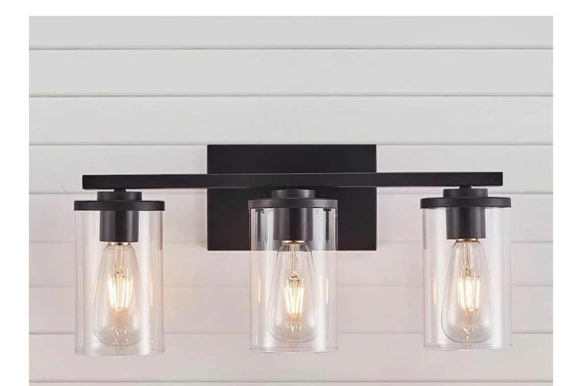 The Fabulis 3-light vanity fixture (Model B03-054-03 with the "-SB" silver/brushed nickel finish) is a modern wall sconce.