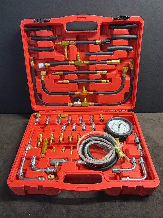 Pressure testing kit with multiple range of fittings