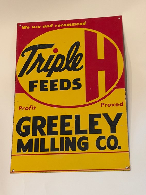 Vintage Triple H feeds metal sign