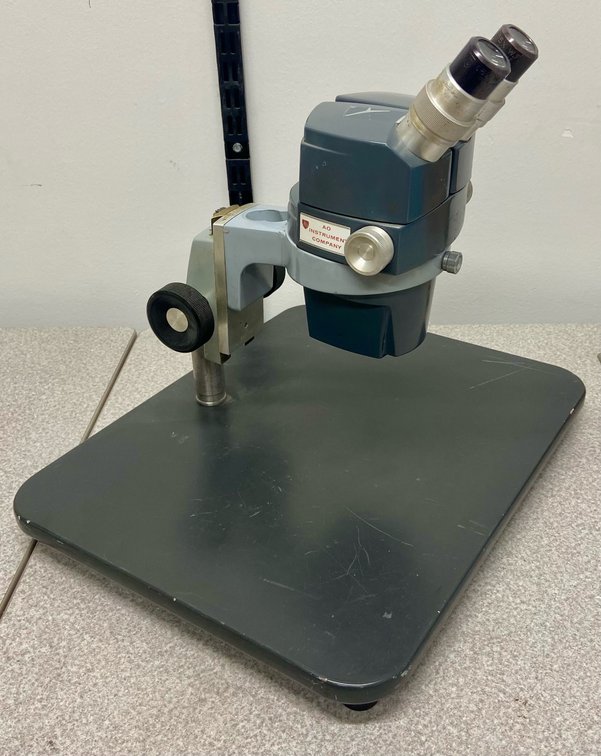 18. AO 569 Stereo Microscope, 0.7-3X with 15X Wide Field Eyepieces on Platform Stand