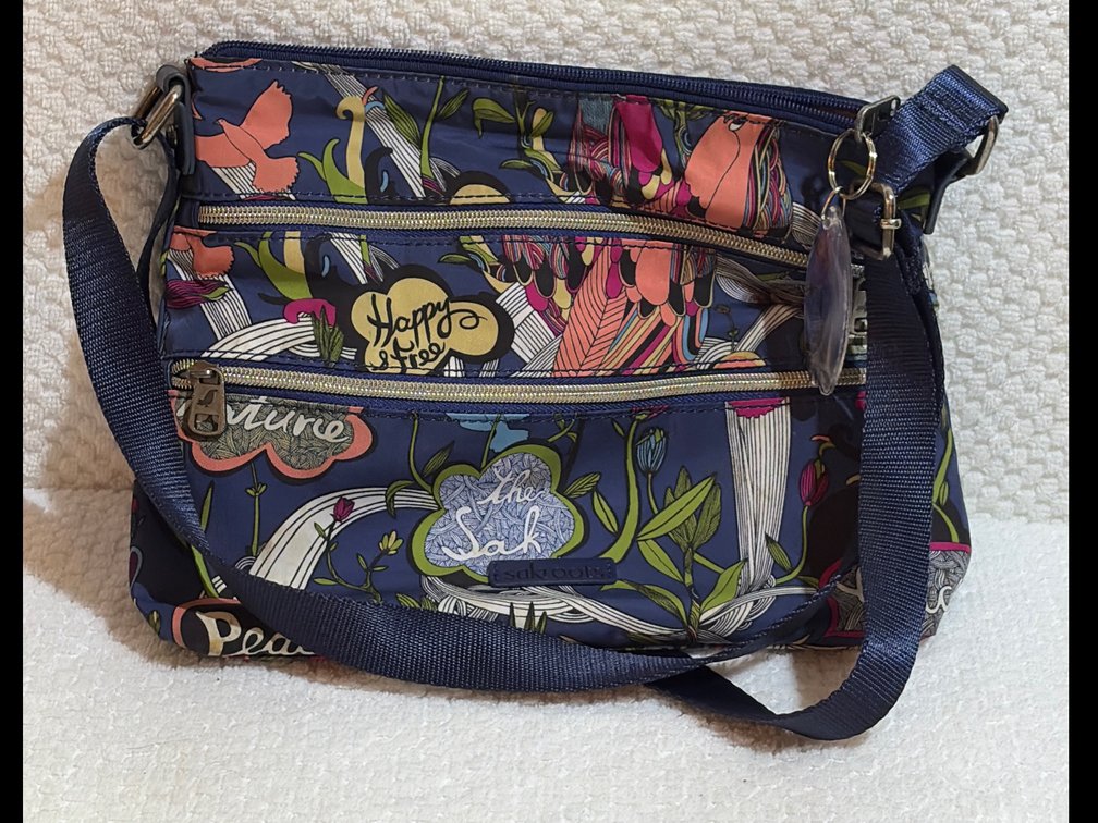 Sakroots crossbody bag with floral and bird pattern