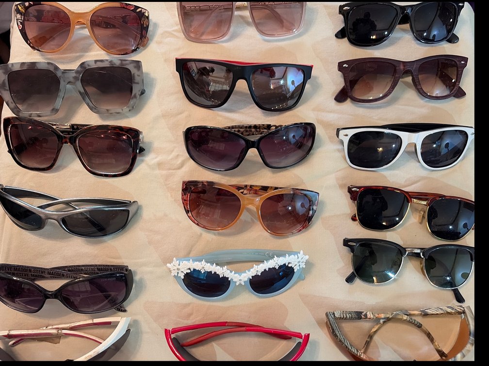18 pairs of sunglasses