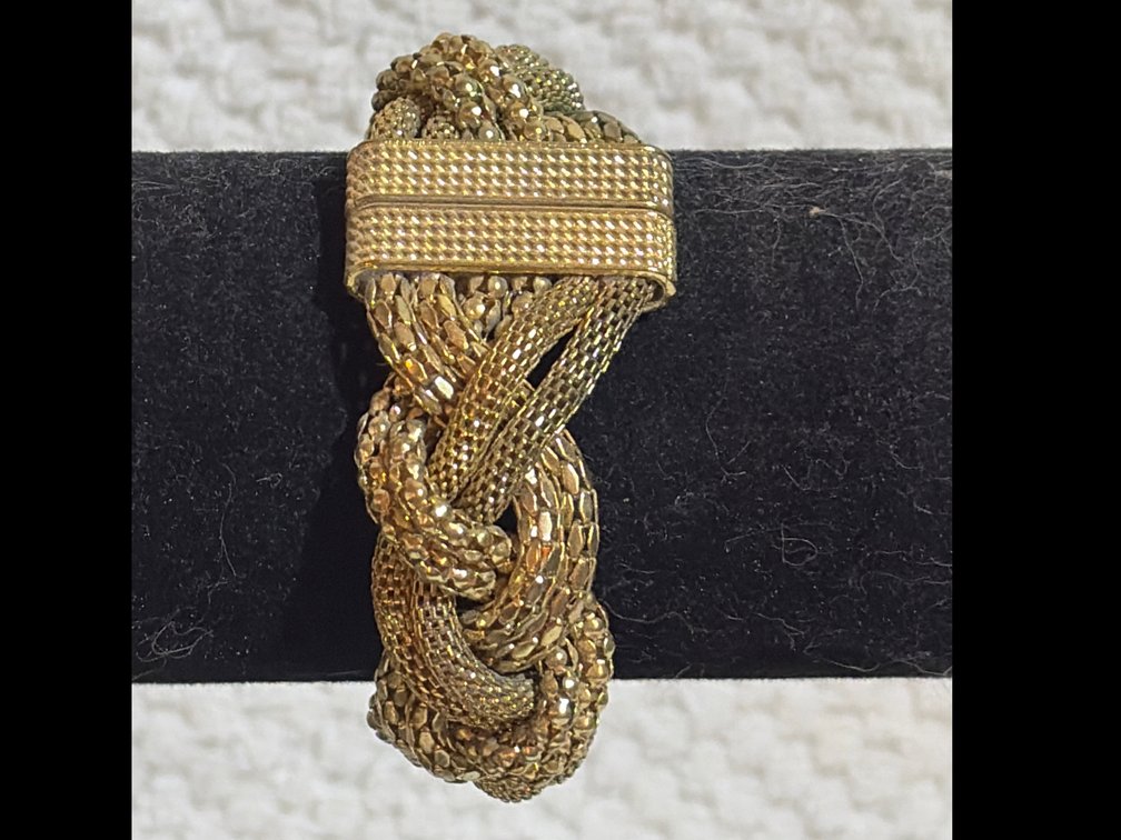 Gold-tone braided mesh statement bracelet with a magnetic clasp