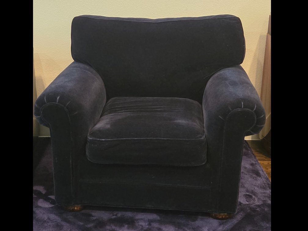Deep navy blue plush velvet armchair