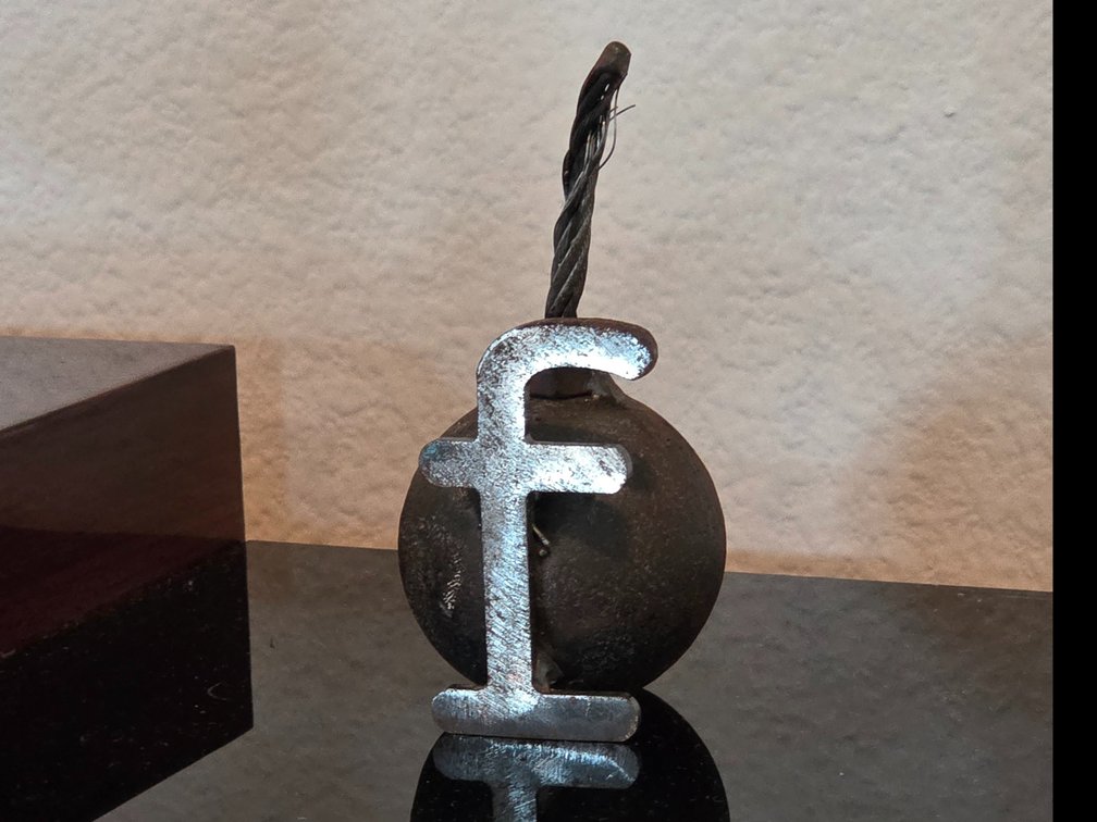 F bomb metal sculpture