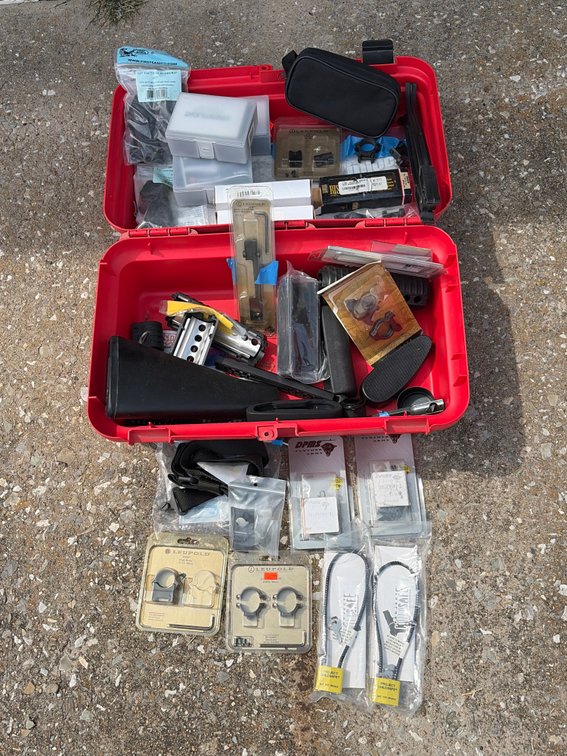 Red tool box with gun accessories, gun locks, scope, mounts, stock, grips I’m related