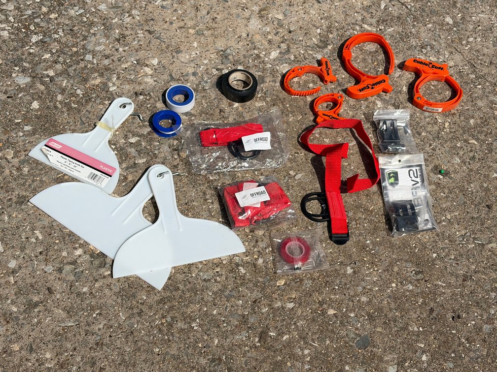 Plastic taping knives, off-road straps, cable cuffs