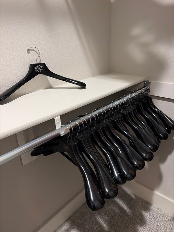Group of 28 high-quality wooden garment hangers