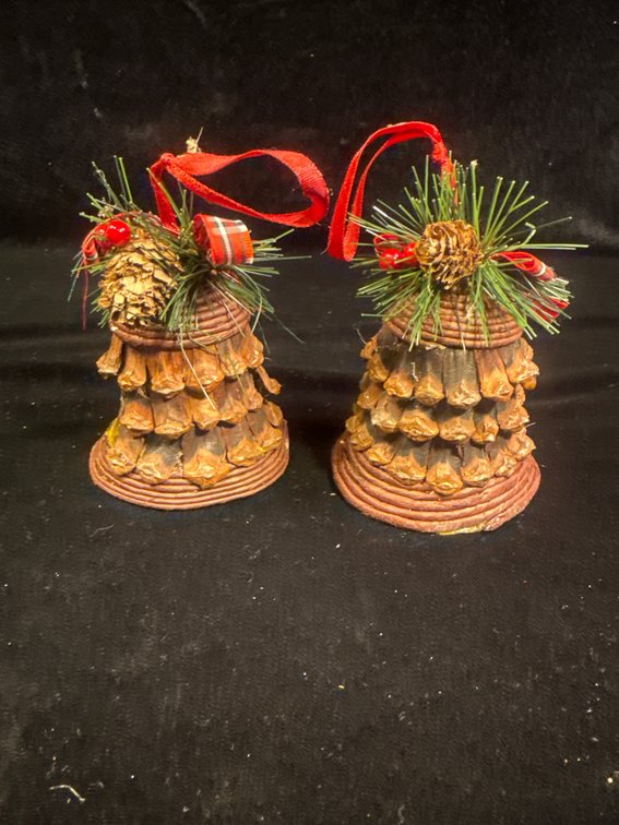 vintage pinecone bell Christmas ornaments decorated with artificial pine needles, red-and-gold plaid bows, and red ribbon loops