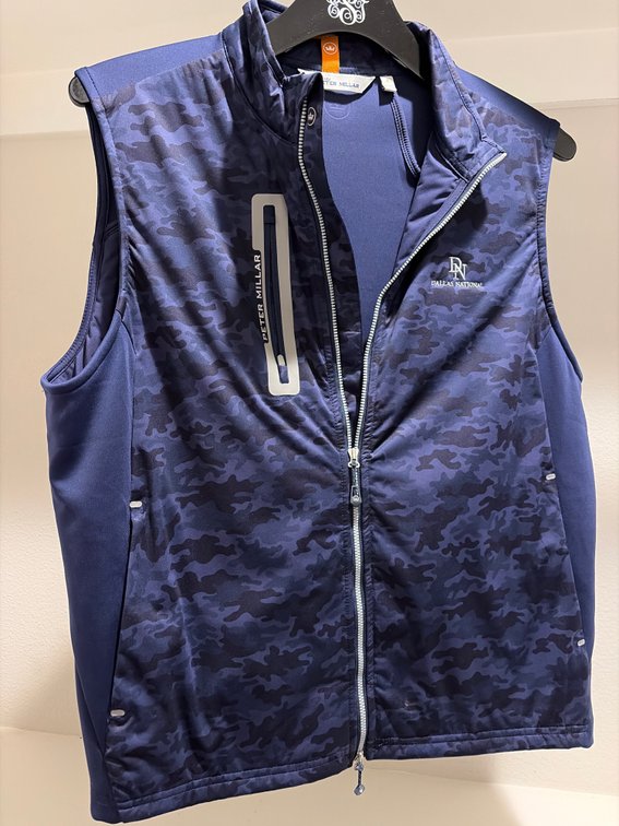 Peter Millar golfing vest with Dallas national logo