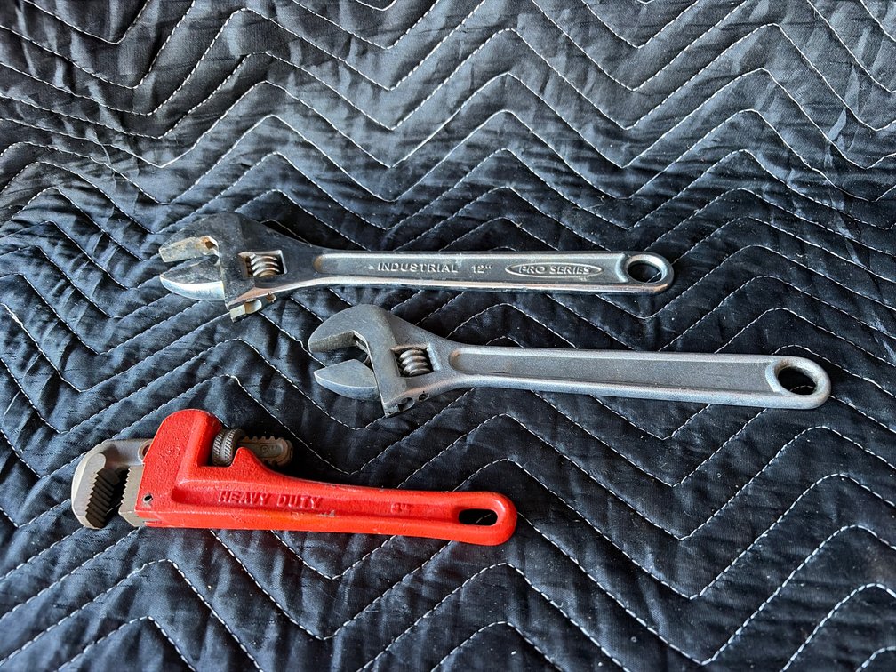 Small pipe wrench, two crescent wrenches