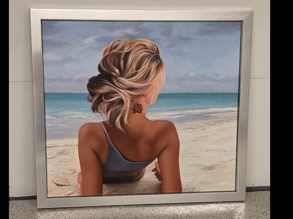Framed Canvas of a tattooed girl on the beach