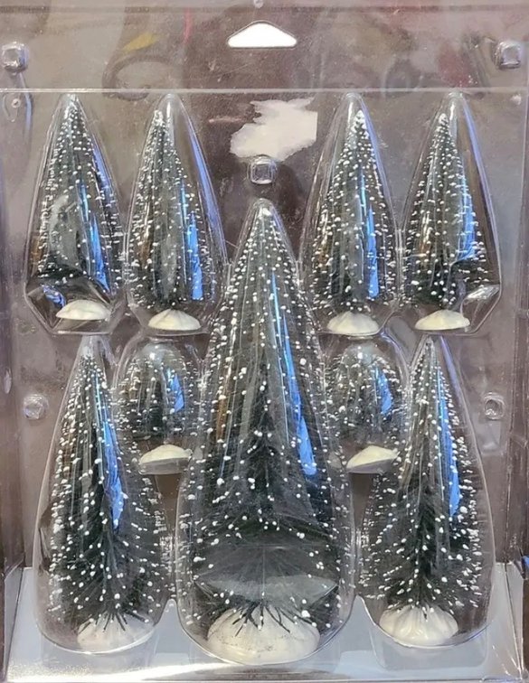 nine miniature flocked bottle brush Christmas trees in a clear plastic package, resembling a Lemax Christmas Village Pine Tree Set