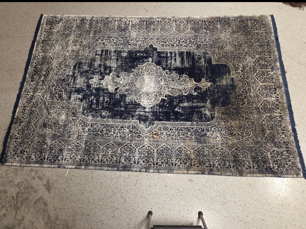 Vintage-style distressed area rug