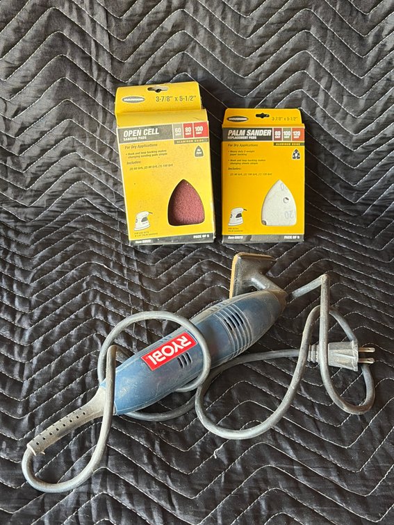 Ryobi electric sander with sandpaper