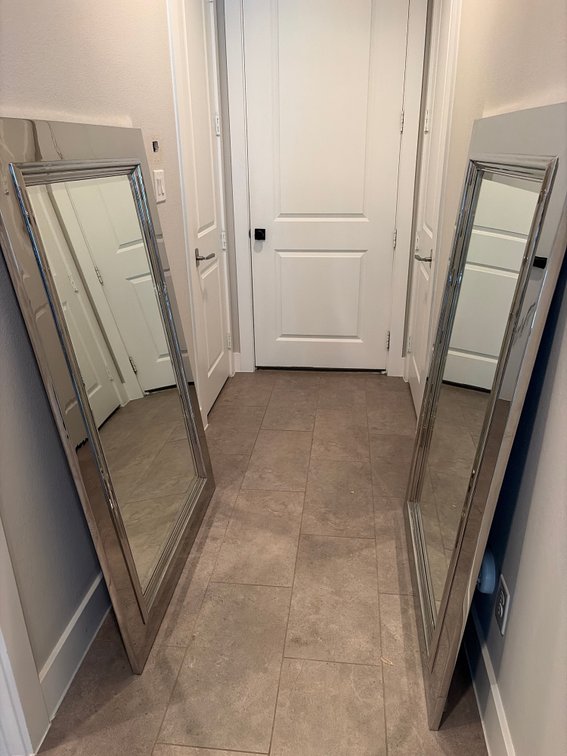 Pair of chrome framed bevel edged mirrors