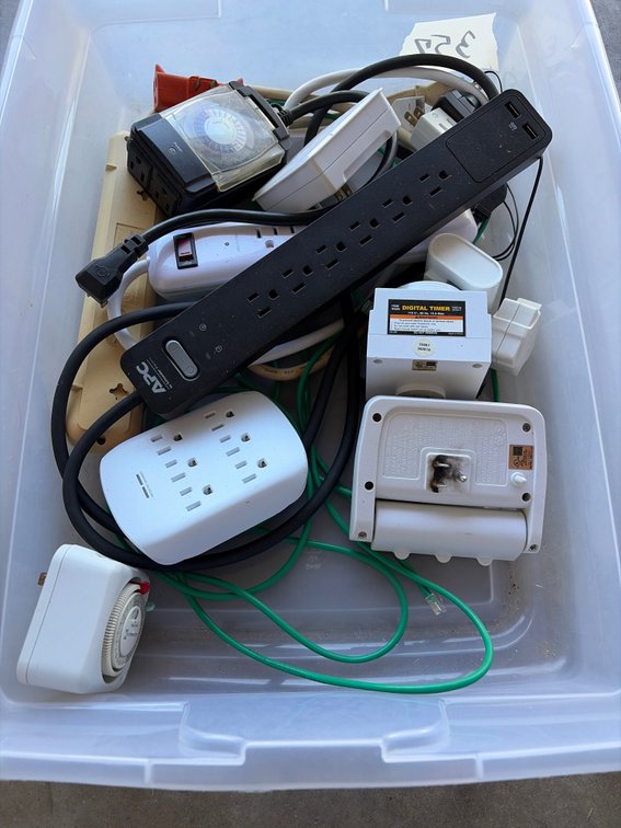 Clear tote with surge protectors, multi outlets, and timers