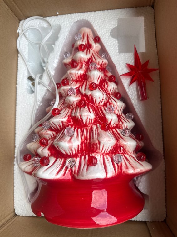 15-inch Peppermint Ceramic Pre-Lit Hand-Painted Christmas Tree (such as models by Casafield or Best Choice Products), featuring a red-and-white candy cane design with colorful twist-in bulbs and a matching star topper