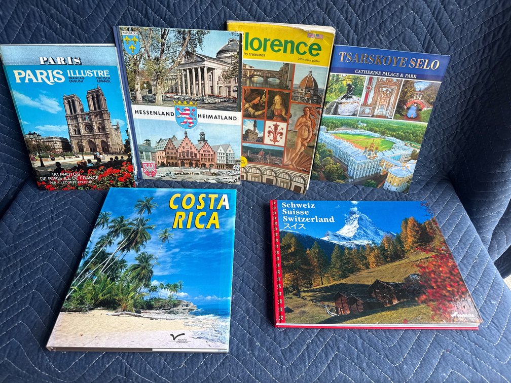 collection of six vintage and regional travel guidebooks and photo books featuring international destinations
