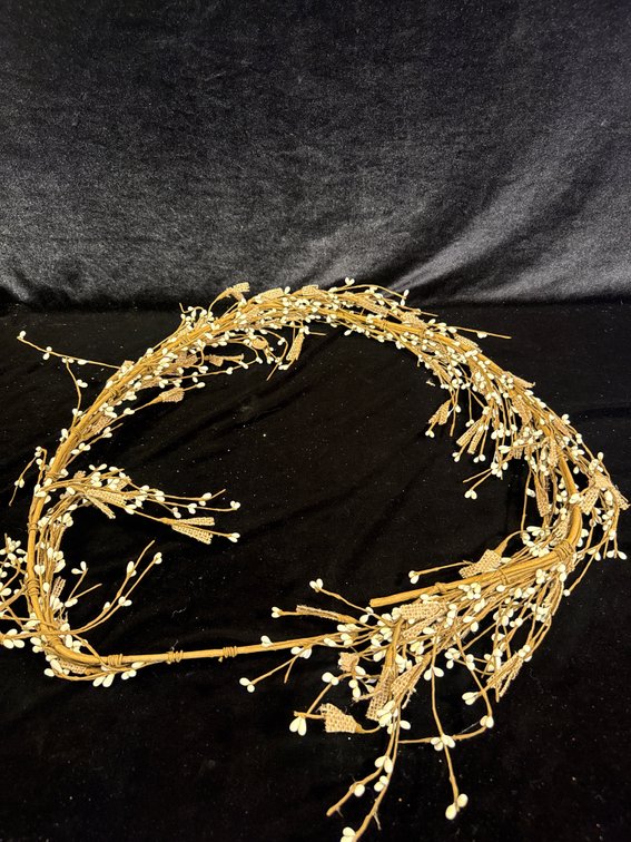 Wreath:  cream/white pip berry garland wrapped in brown floral paper, accented with textured burlap strips