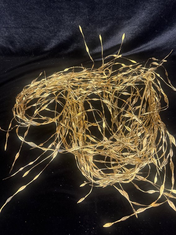 bundle of metallic gold artificial willow or bamboo leaf branches