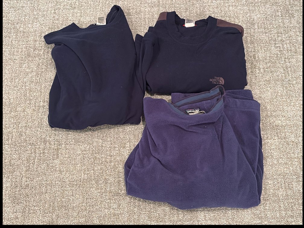 Two Northface and one Patagonia fleece pullover
