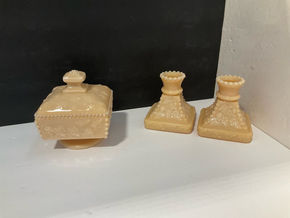 Westmoreland custard glass candleholders, covered candy dish