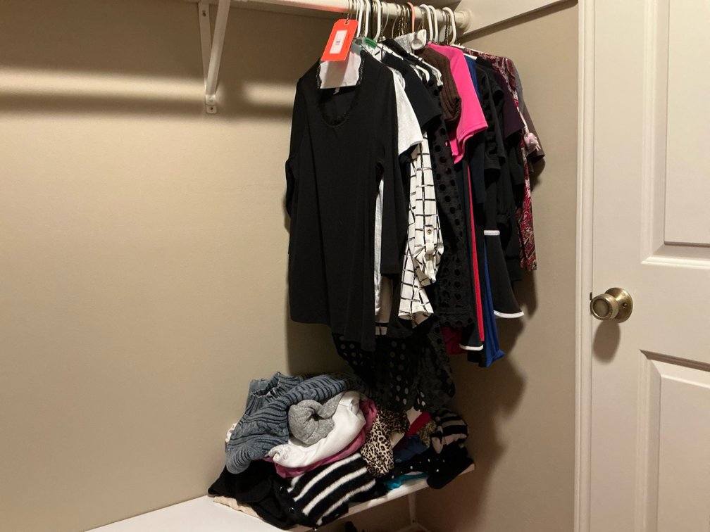 Grouping of ladies clothing hanging & under Size S-Master bedroom closet