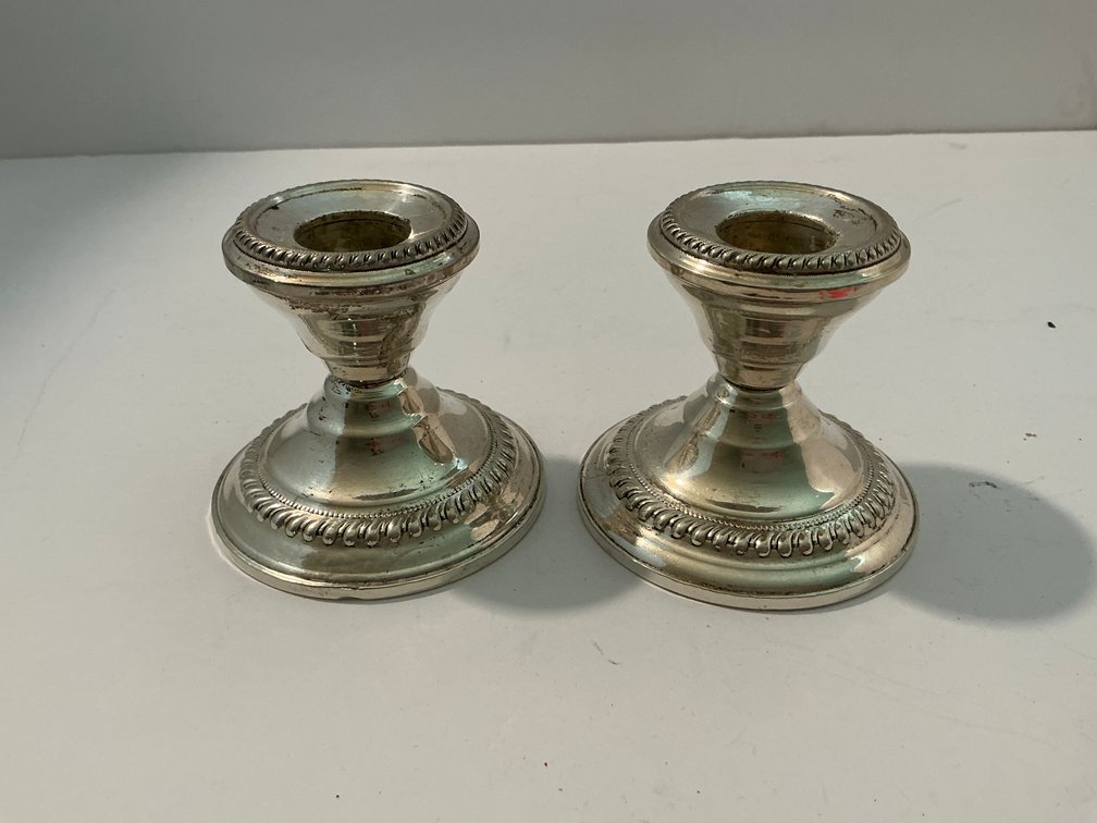 Pair of sterling weighted candle holders -Master bedroom