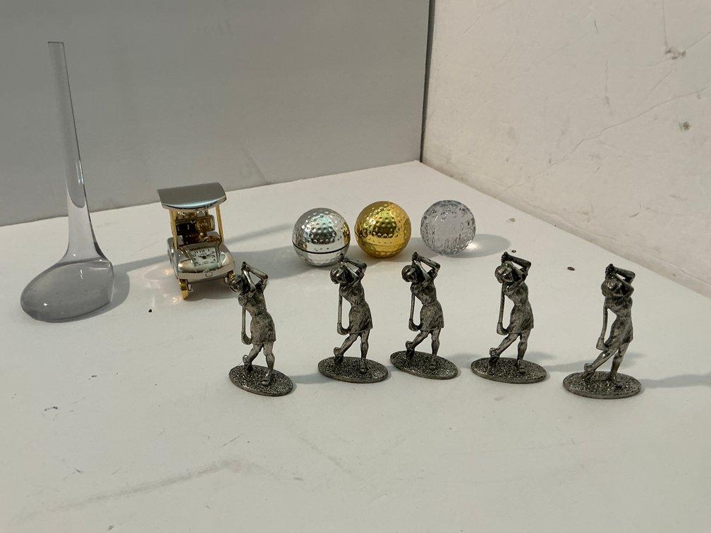 Clock & golf related figures -Master bedroom