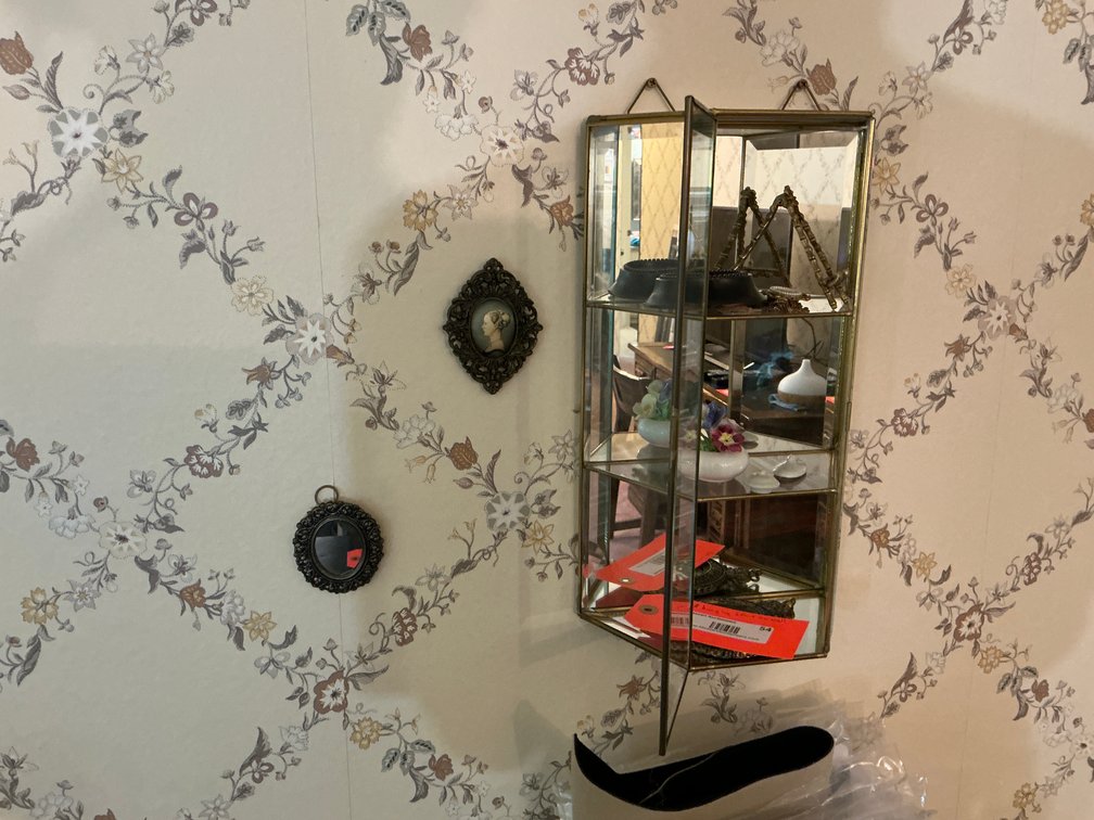 Small wall mounted knick knack cabinet with mirrored back -Master bedroom
