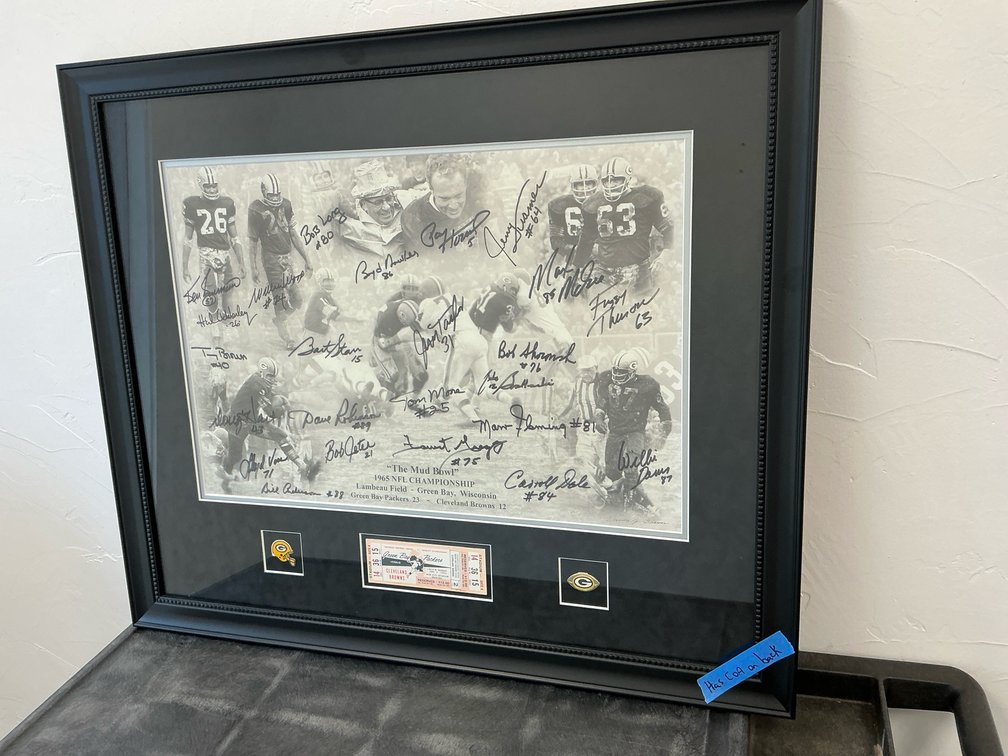 Autographed “The Mud Bowl” print & game ticket with COA 31x26”