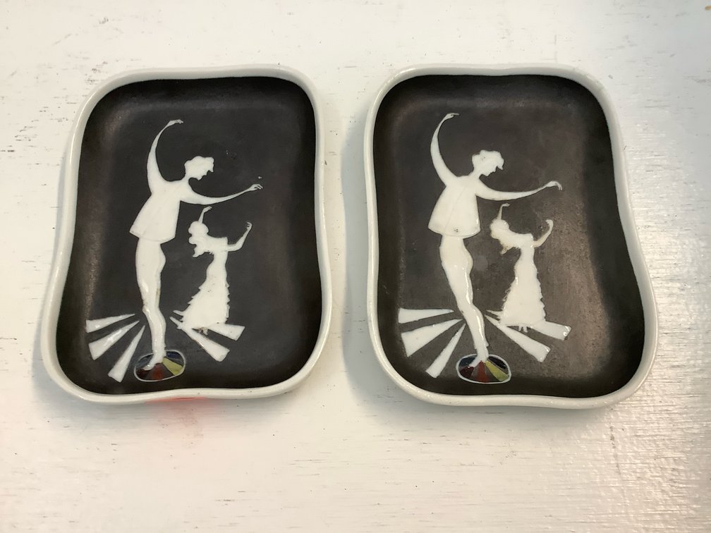 Two white ceramic trinket dishes
