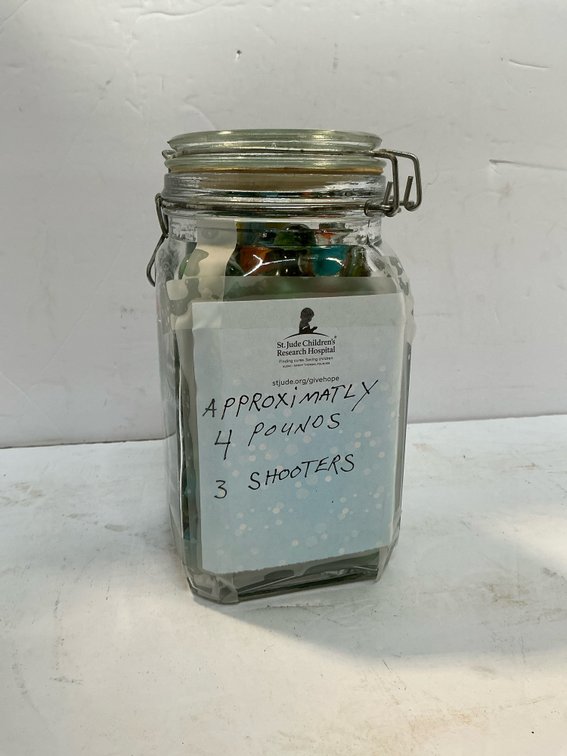 Glass jar of assorted marbles