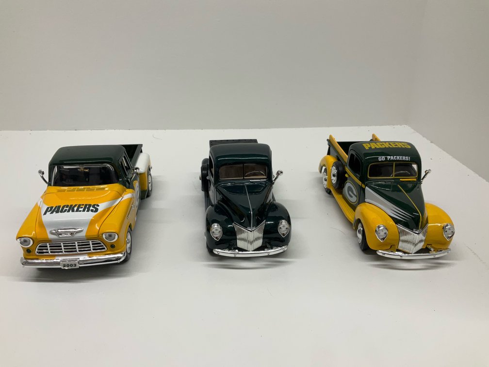 3 die cast toy Packer pick up trucks
