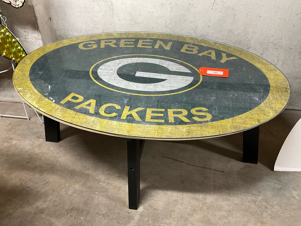 Oval Packers coffee table with glass top 48x30x19”