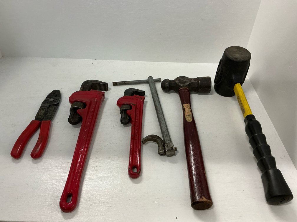 Assorted hand tools with Ridge Tool Co. pipe wrenches