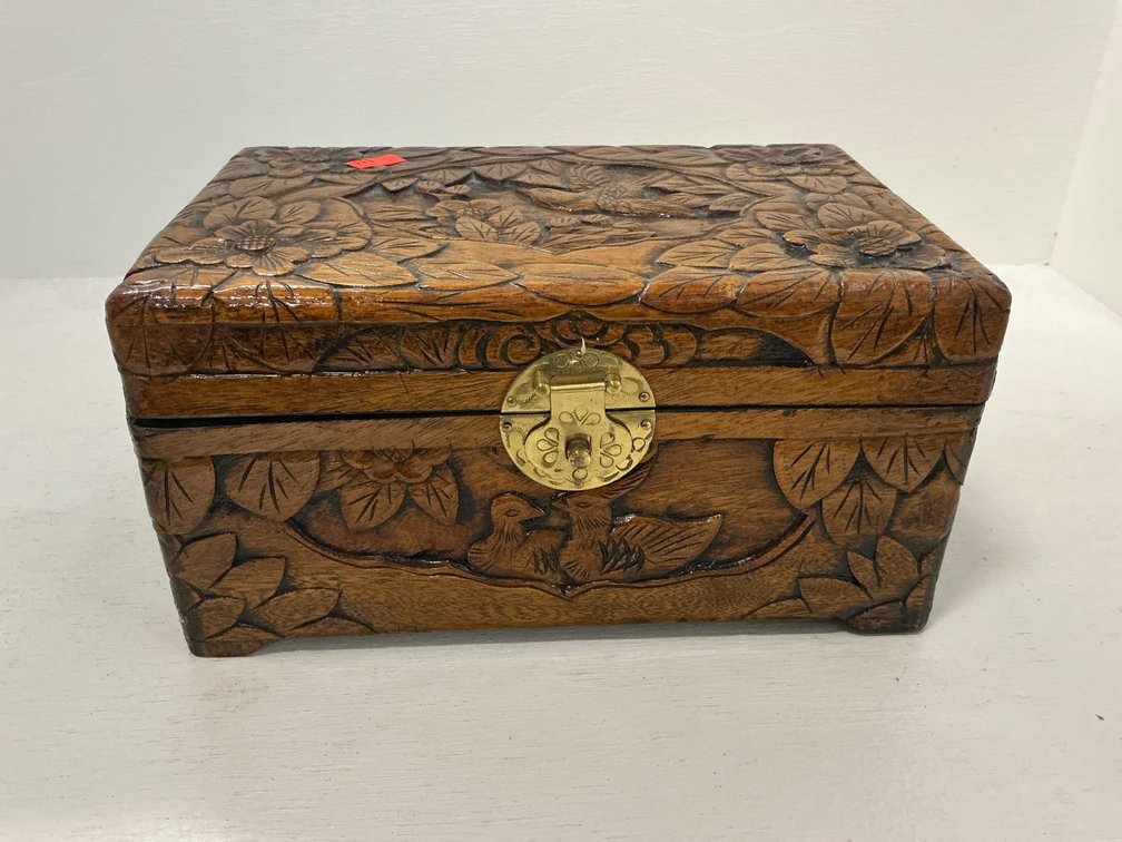 Carved wood trinket box with brass medallion clasp