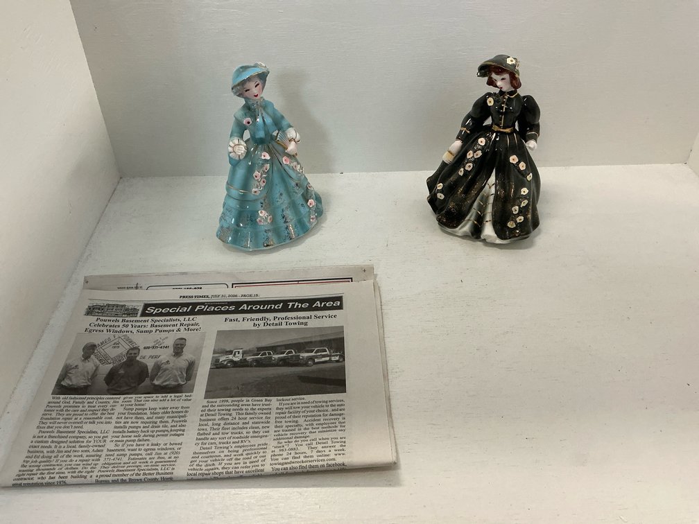 Pair of ceramic lady figurines in blue & black gowns