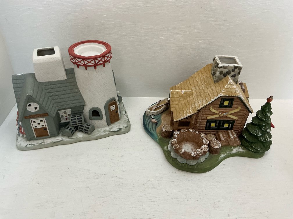 Pair of ceramic lighthouse & log cabin candle holders
