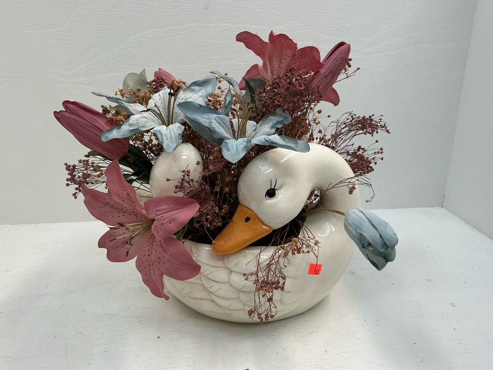 Ceramic swan planter with faux floral arrangement