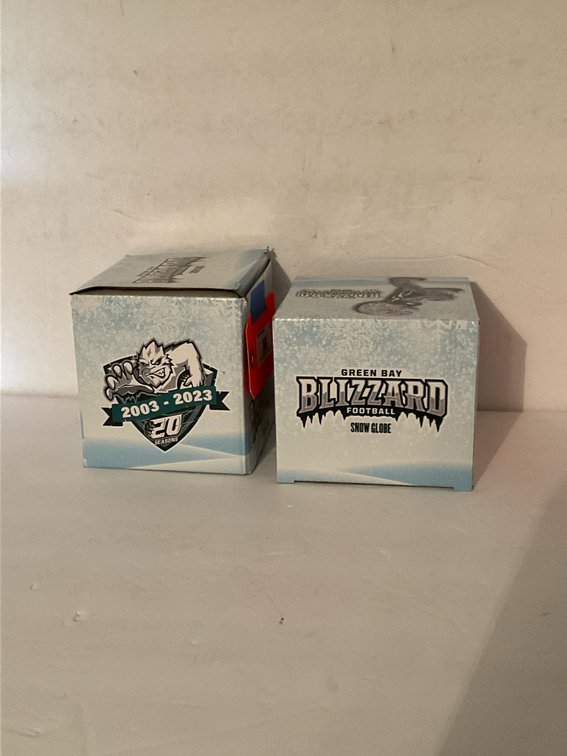 Pair of Green Bay Blizzard 20th season snow globes