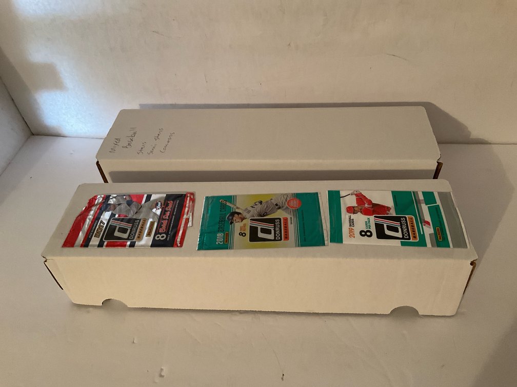 Assorted baseball trading cards in storage box
